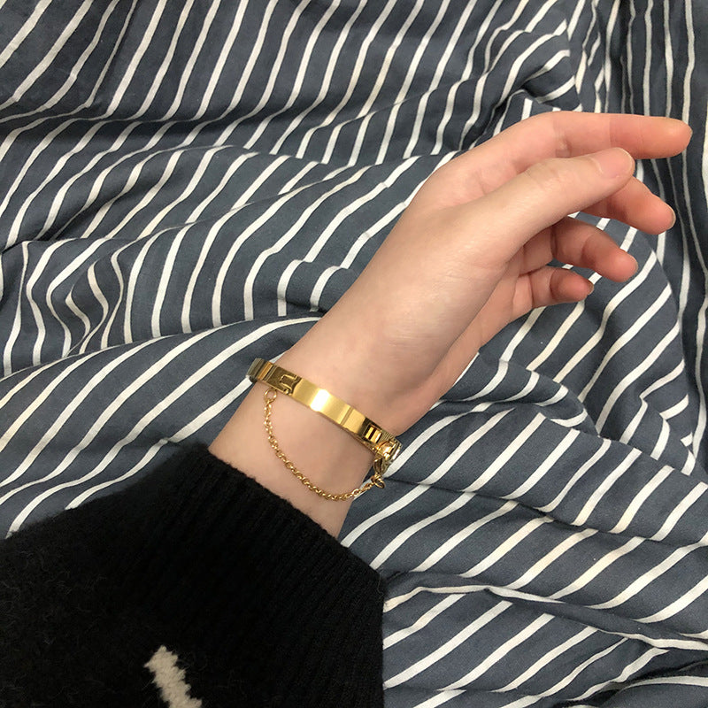 Thin Gold Color Plated Cuff Bracelet with Chain Closure is a thin sized Bracelet that has our signature chained hook closure