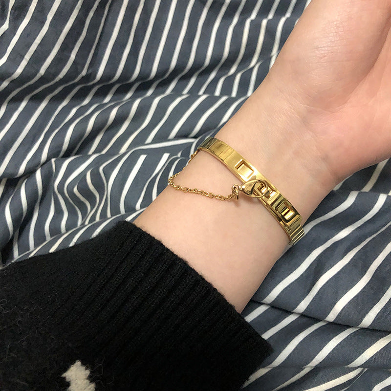 Thin Gold Color Plated Cuff Bracelet with Chain Closure is a thin sized Bracelet that has our signature chained hook closure